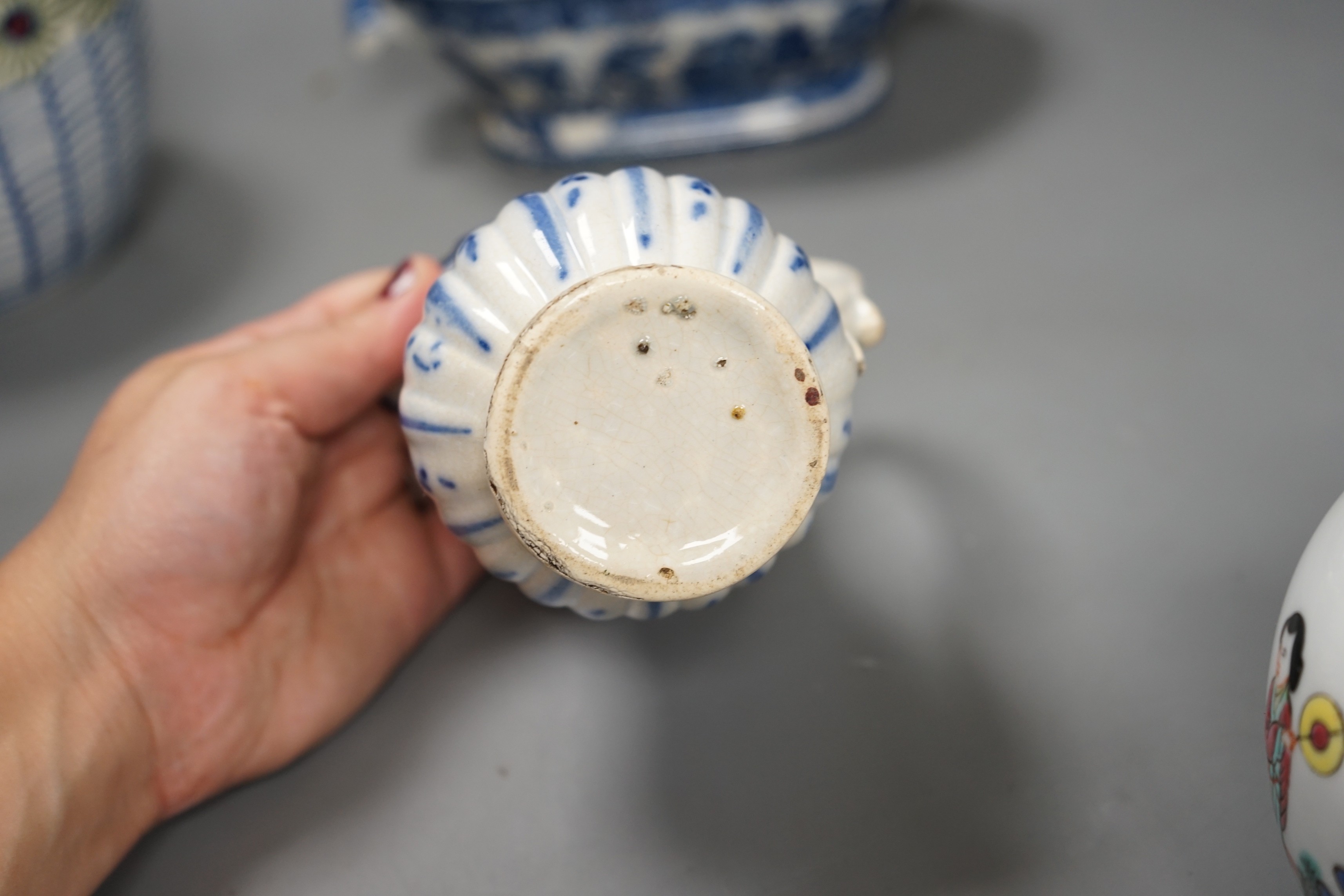 A Chinese famille rose jar and cover, another jar and two English pottery pieces